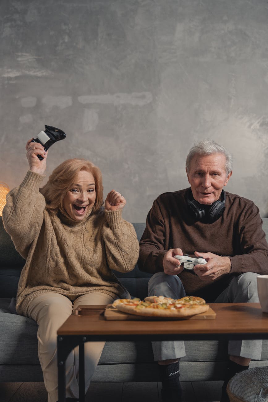 man in black sweater sitting beside woman in brown sweater