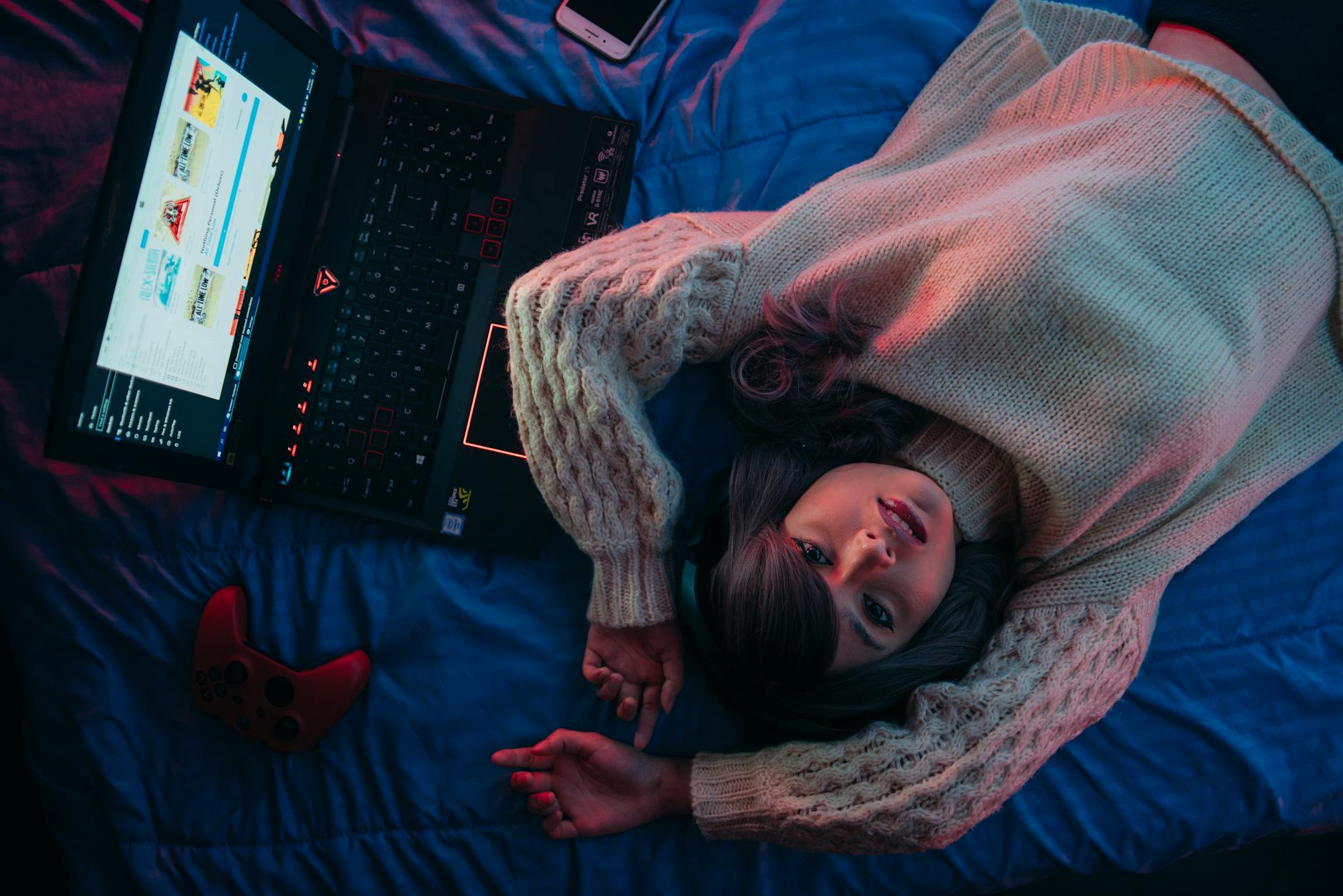 teenage girl lying on bed